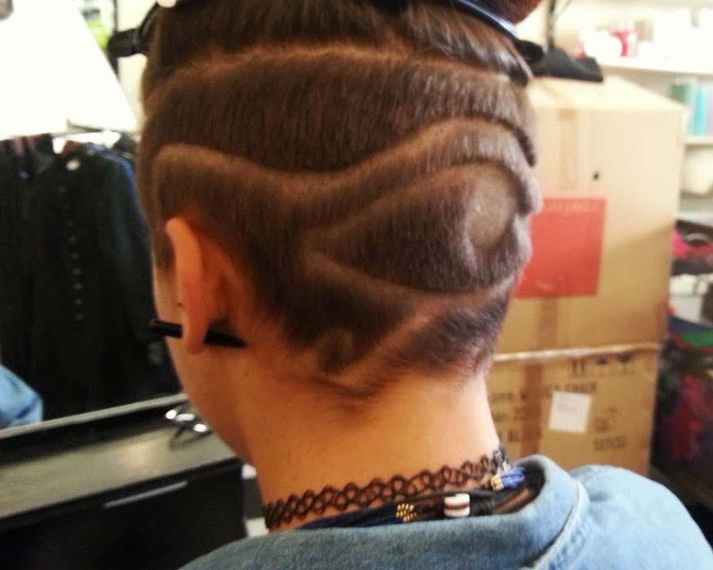 egytian eye swirls hair tattoo 3